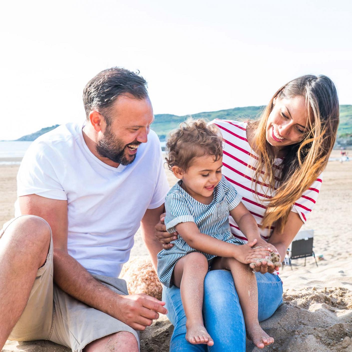 Family playing on Woolacombe Beach