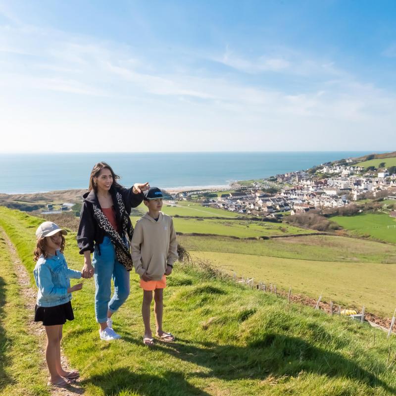 Woolacombe Sands Holiday Park family walking along the footpath to the beach