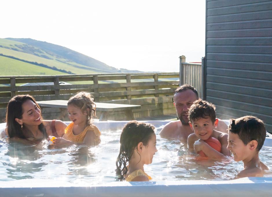 Woolacombe Sands Holiday Park family relaxing in the hot tub