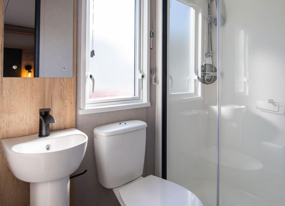 An interior view of the bathroom inside a Diamond caravan at Woolacombe Sands Holiday Park